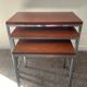 Trio of teak and chrome metal nesting tables from the 60s-70s