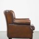Sheep leather armchair finished with decorative nails