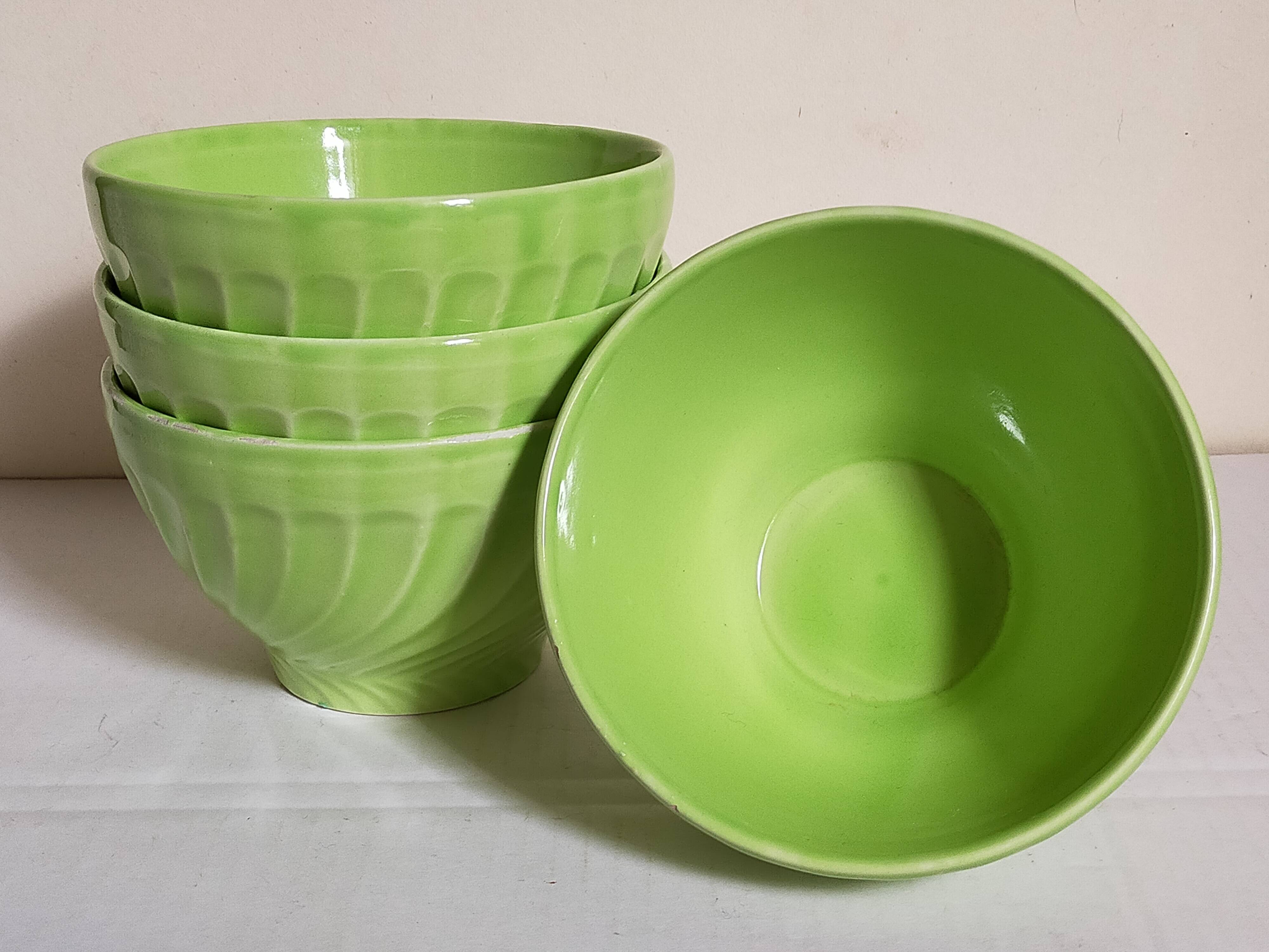 Four vintage spring green earthenware bowls