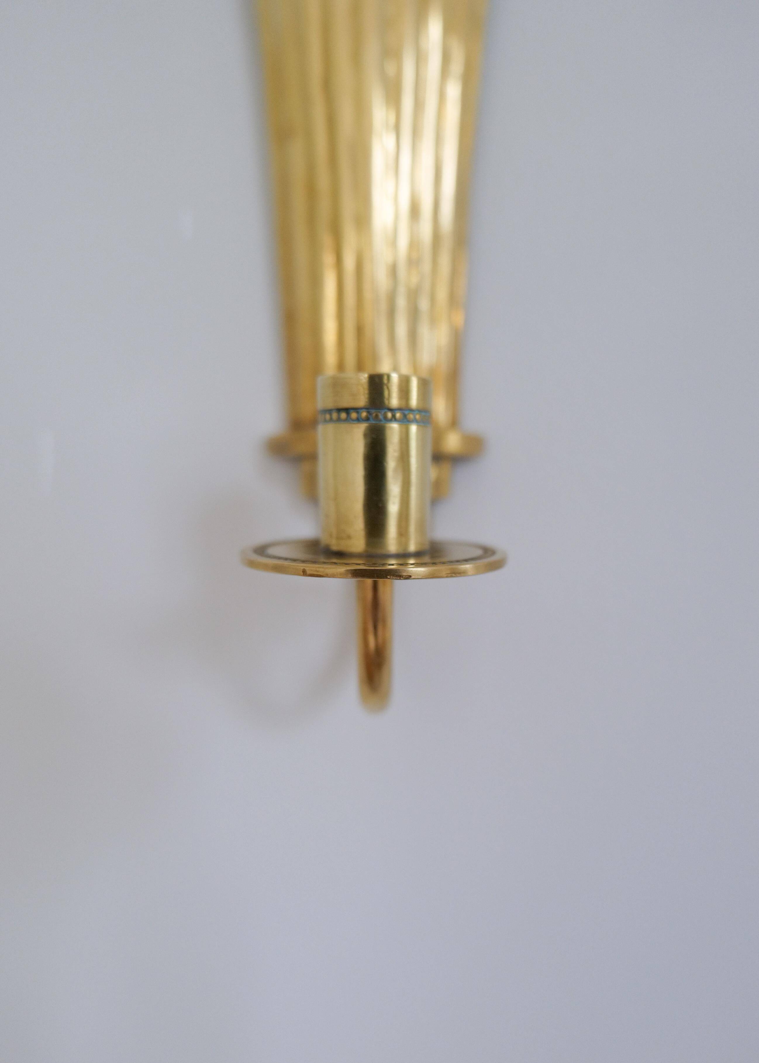 Pair of Art Deco brass wall sconces by Holmström, Arvika, Sweden, 1940s.