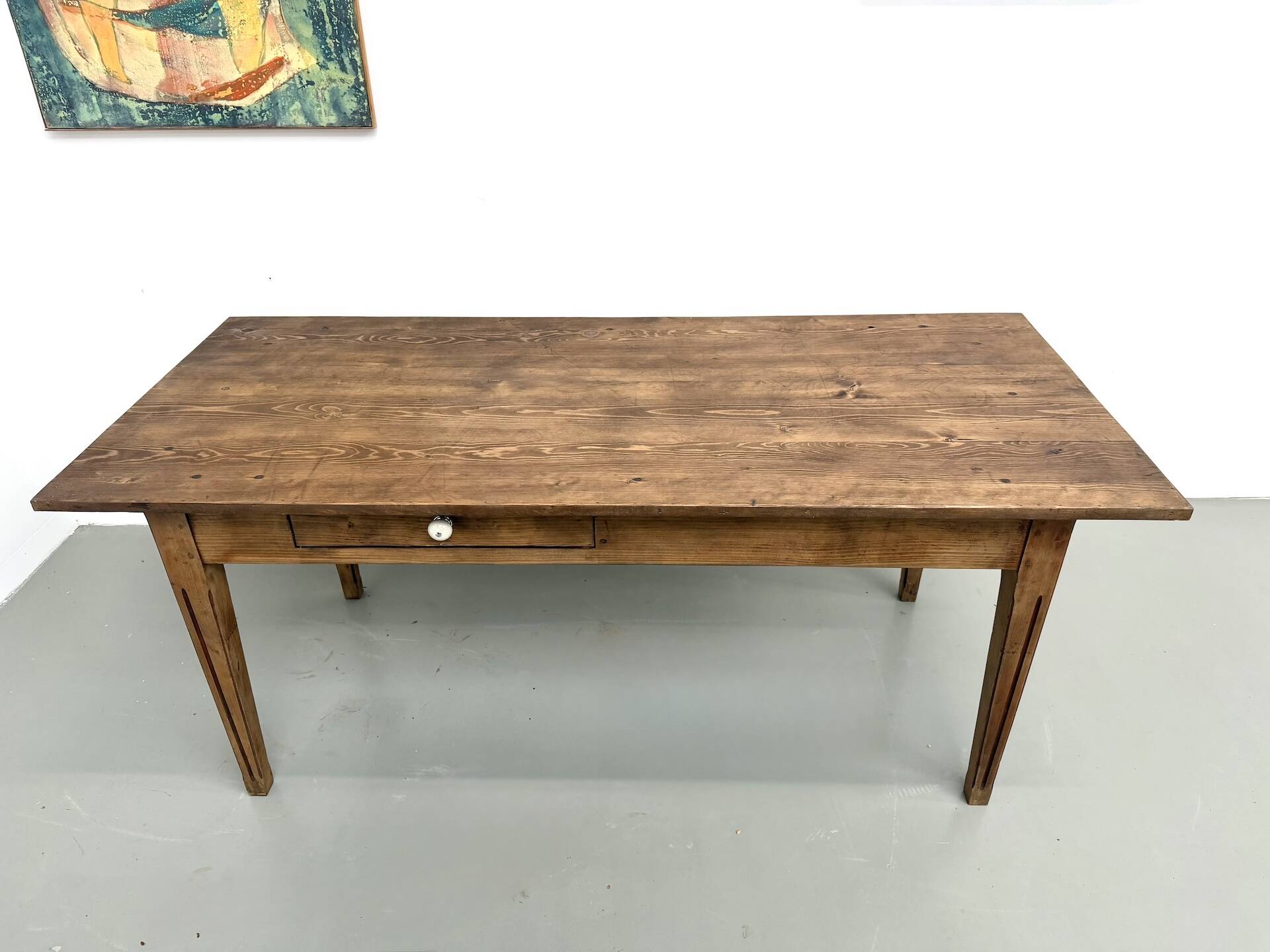 Solid pine farmhouse table, two drawers, fluted legs, France.