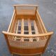 Baby cot in oak and wicker
