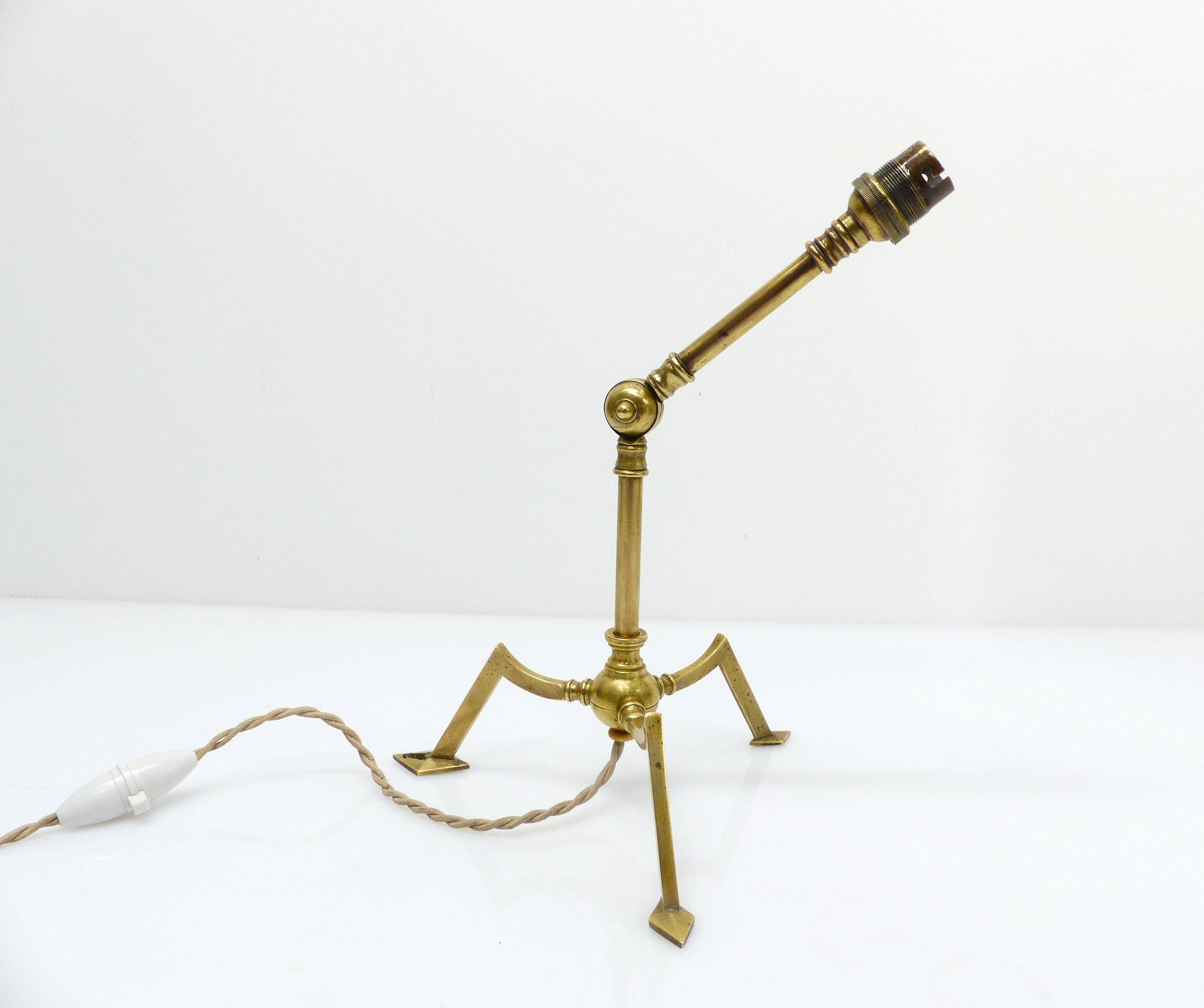 Articulated tripod lamp base in brass, Arts & Crafts style, in the manner of.