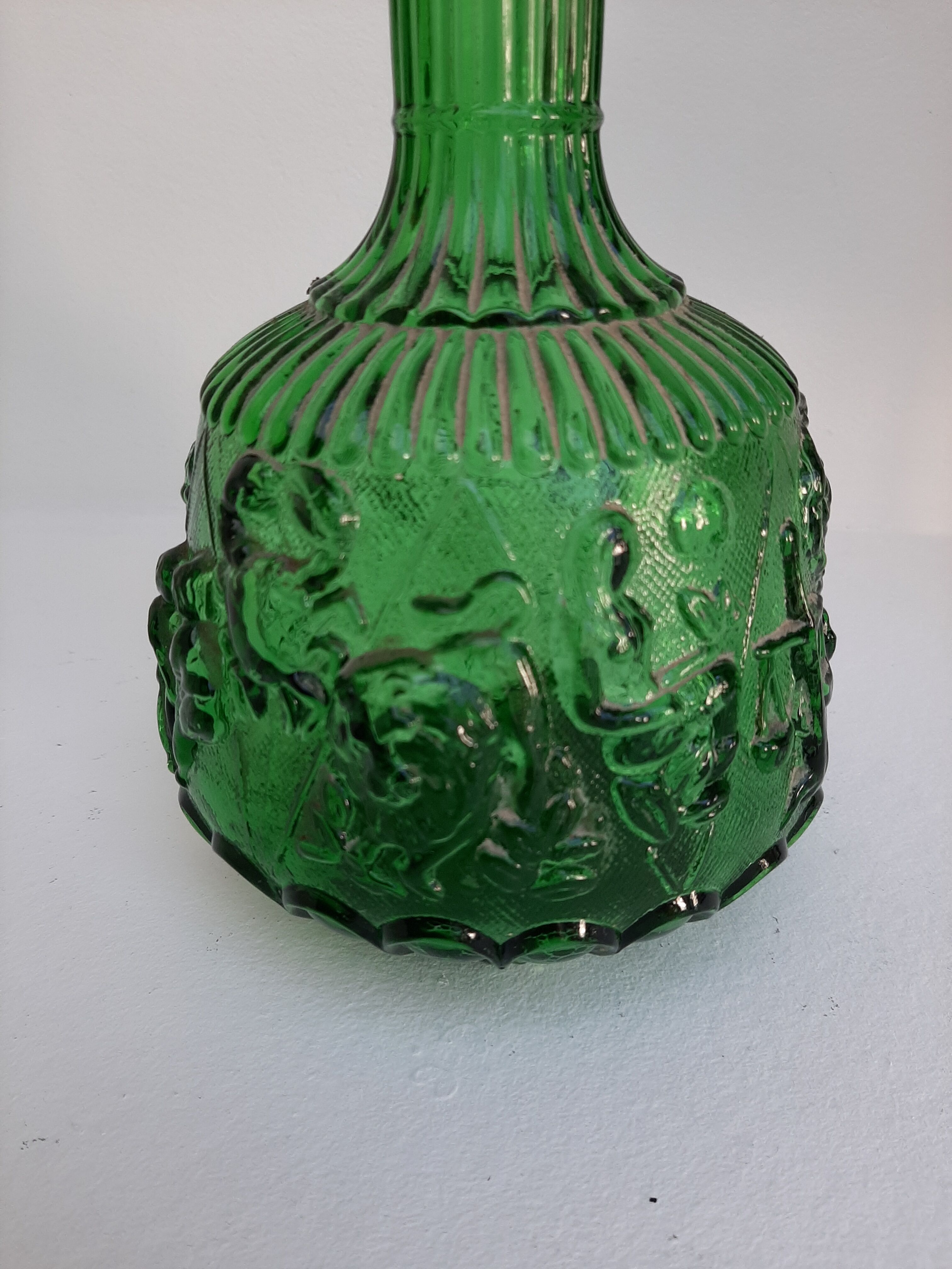 Empoli green glass bottle, zodiac signs