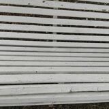 Old garden bench with metal legs and wooden slats