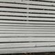 Old garden bench with metal legs and wooden slats