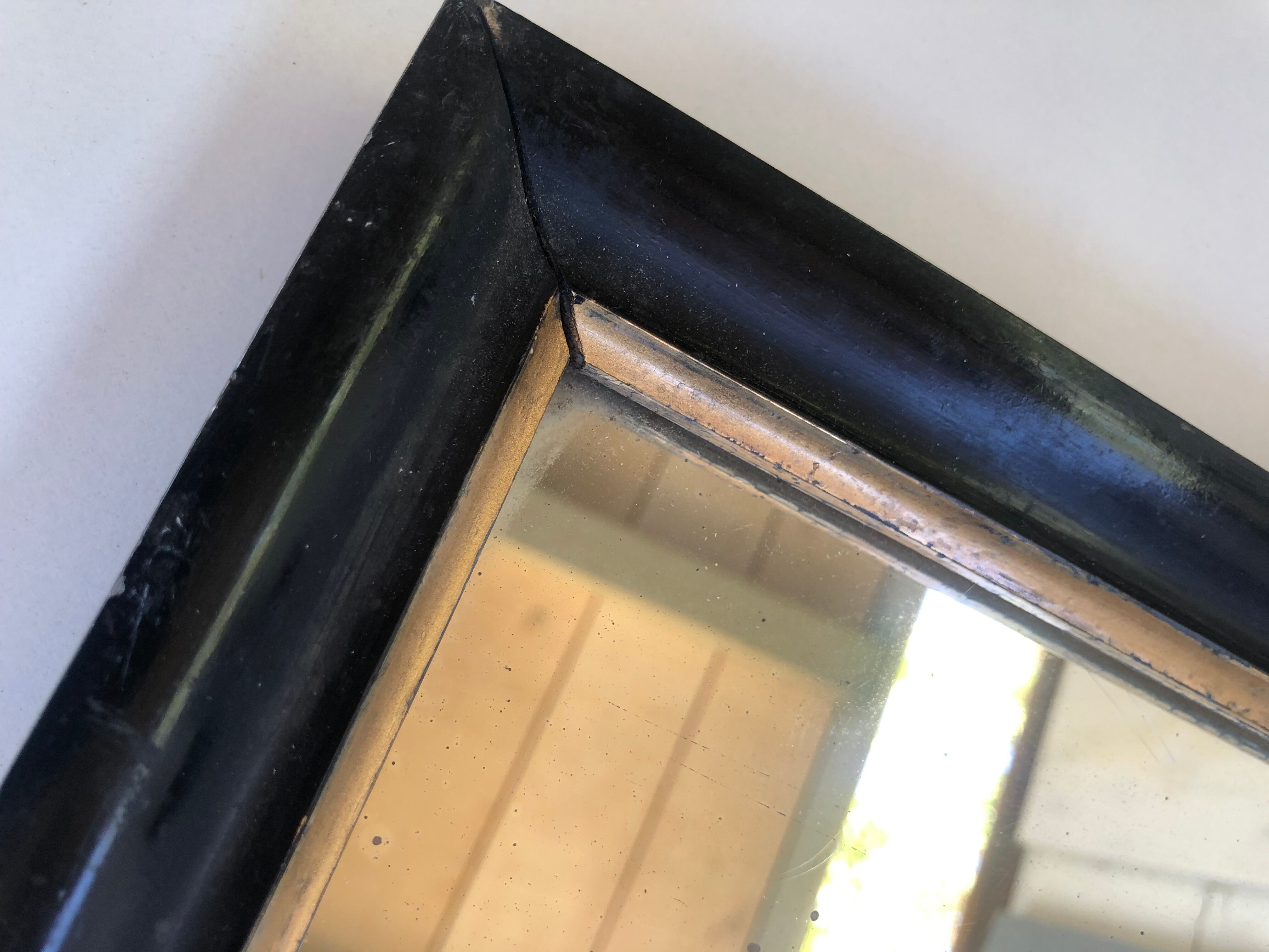 Miroir ancien bois noir et or
