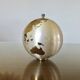 Large terrestrial globe, cigarette dispenser, brass, 1960 - 1970