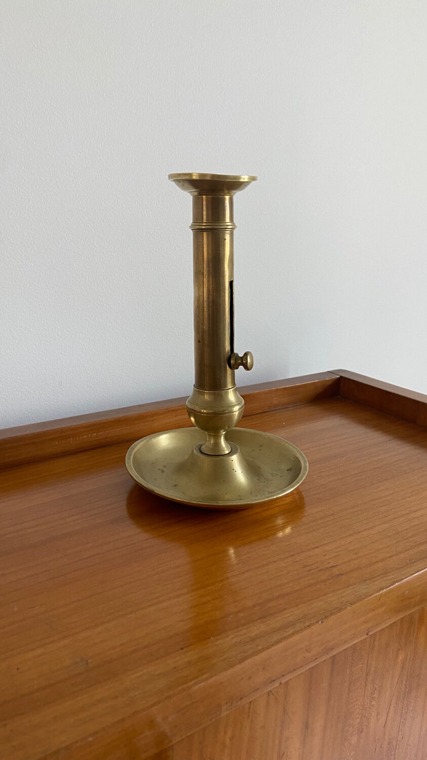Antique brass push candle holder