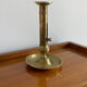 Antique brass push candle holder
