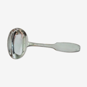 Old porridge spoon in silver metal