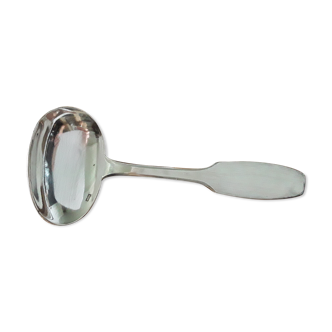 Old porridge spoon in silver metal