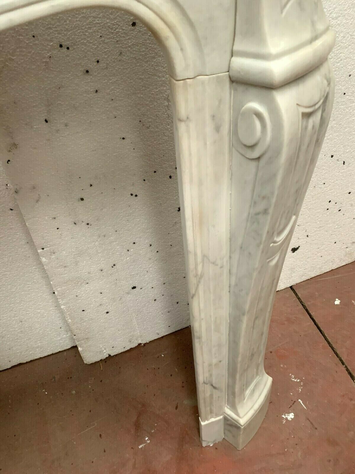Louis XV style fireplace in white marble veined Carrara Italy 20th century