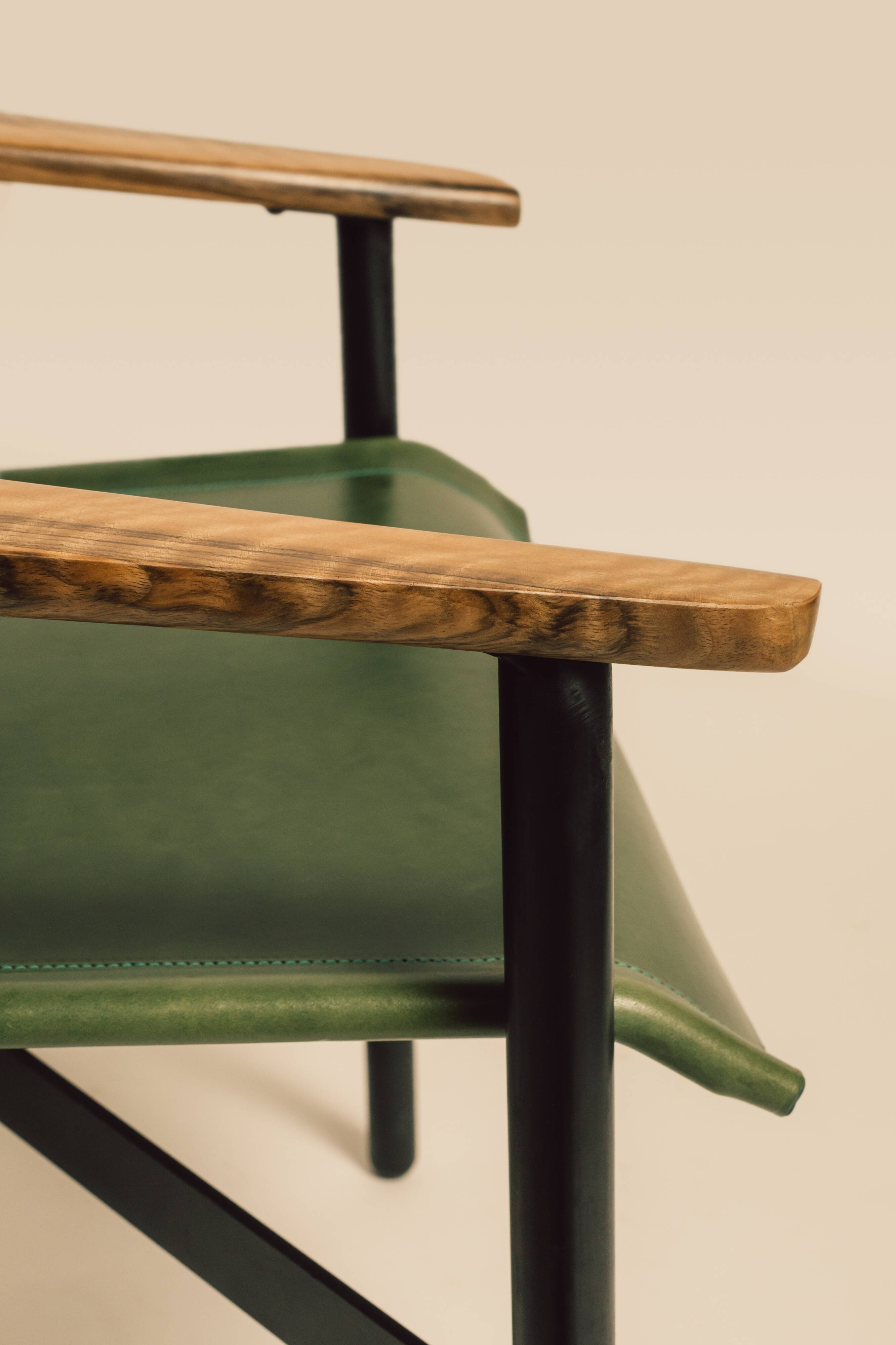 Maërl armchair, Galathée model, green leather, solid wood armrests of your choice