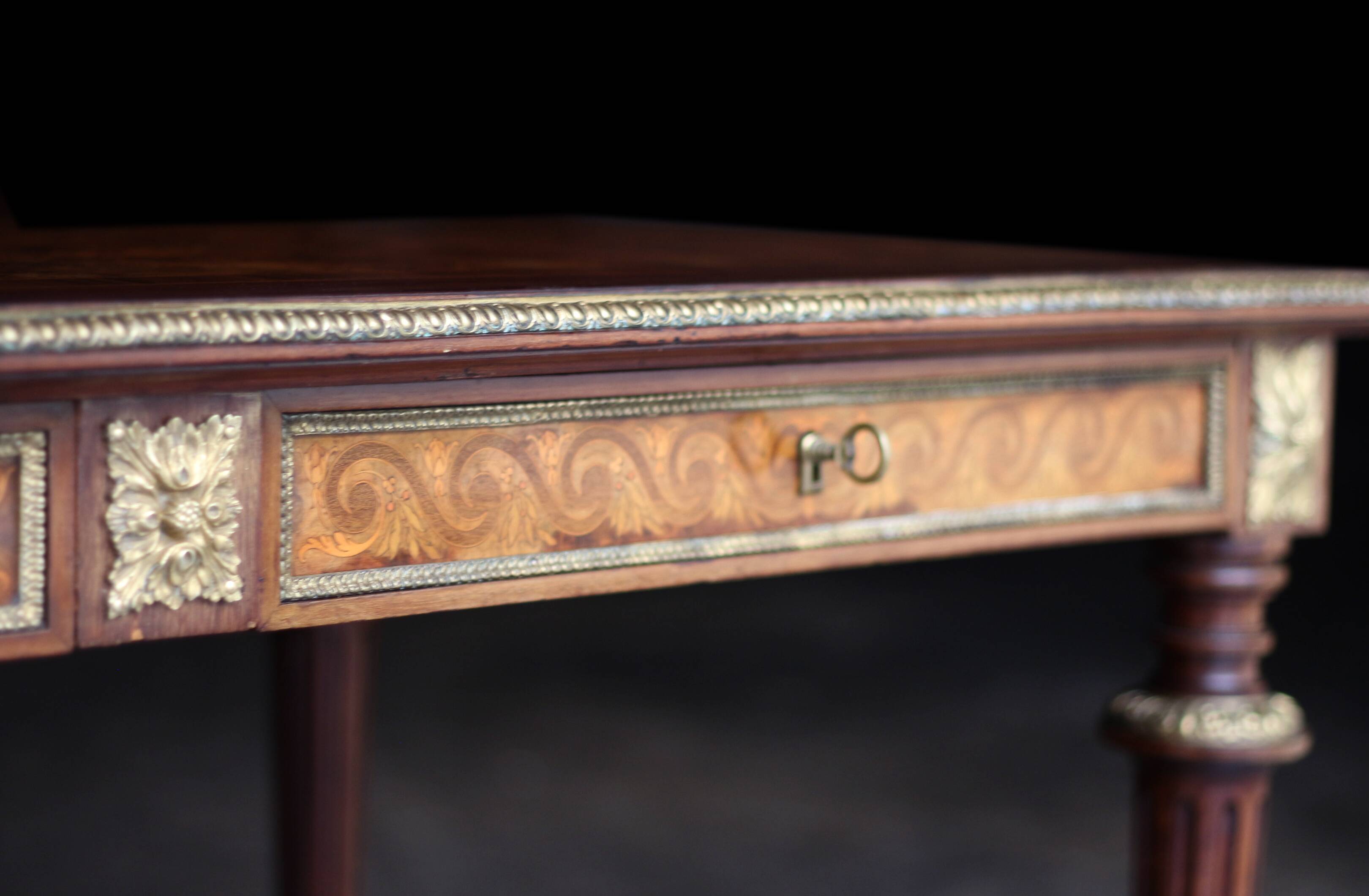 Superb Napoleon III table. Marquetry top and gilded bronzes.