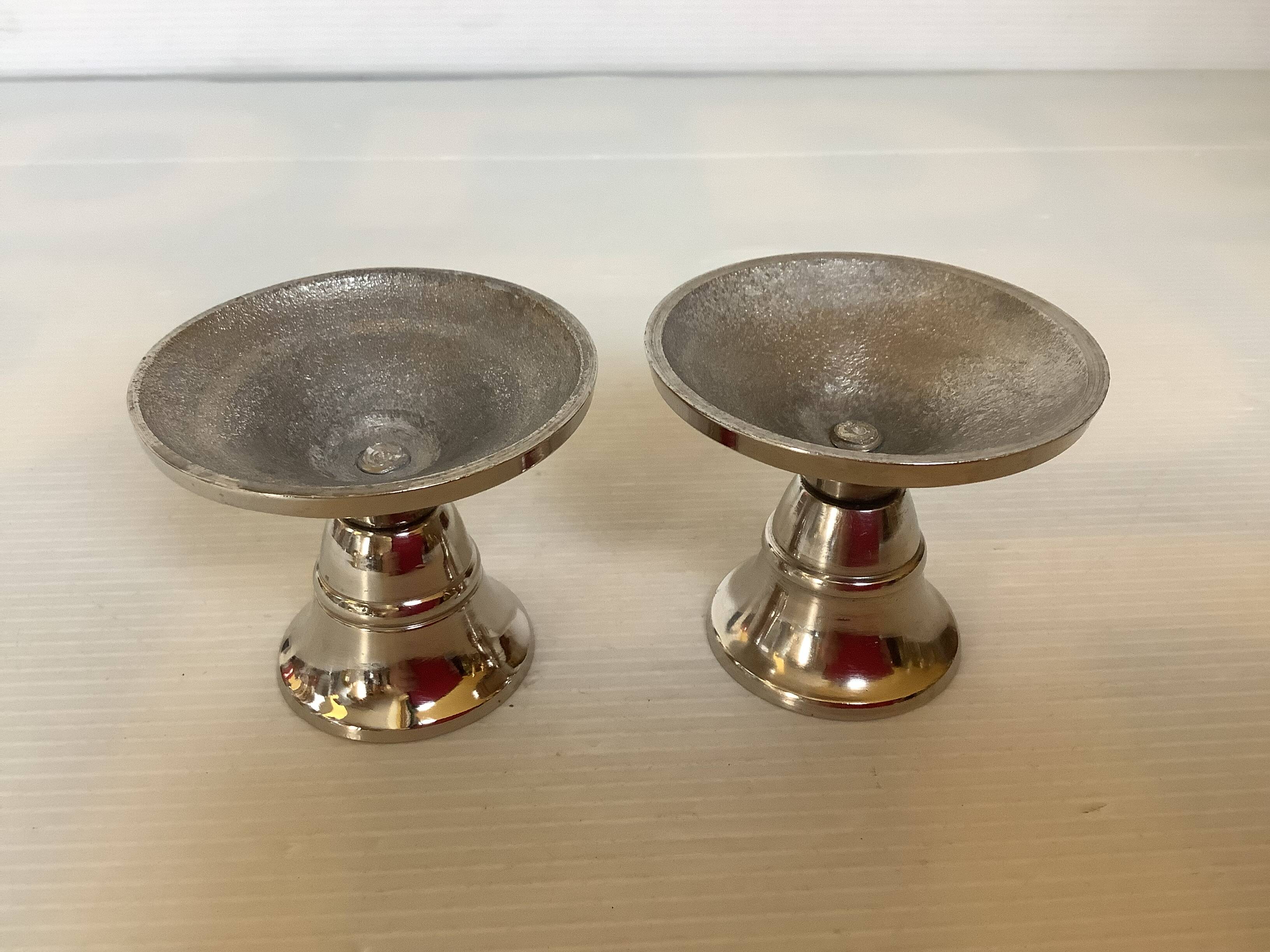 Pair of small silver metal candlesticks