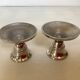 Pair of small silver metal candlesticks