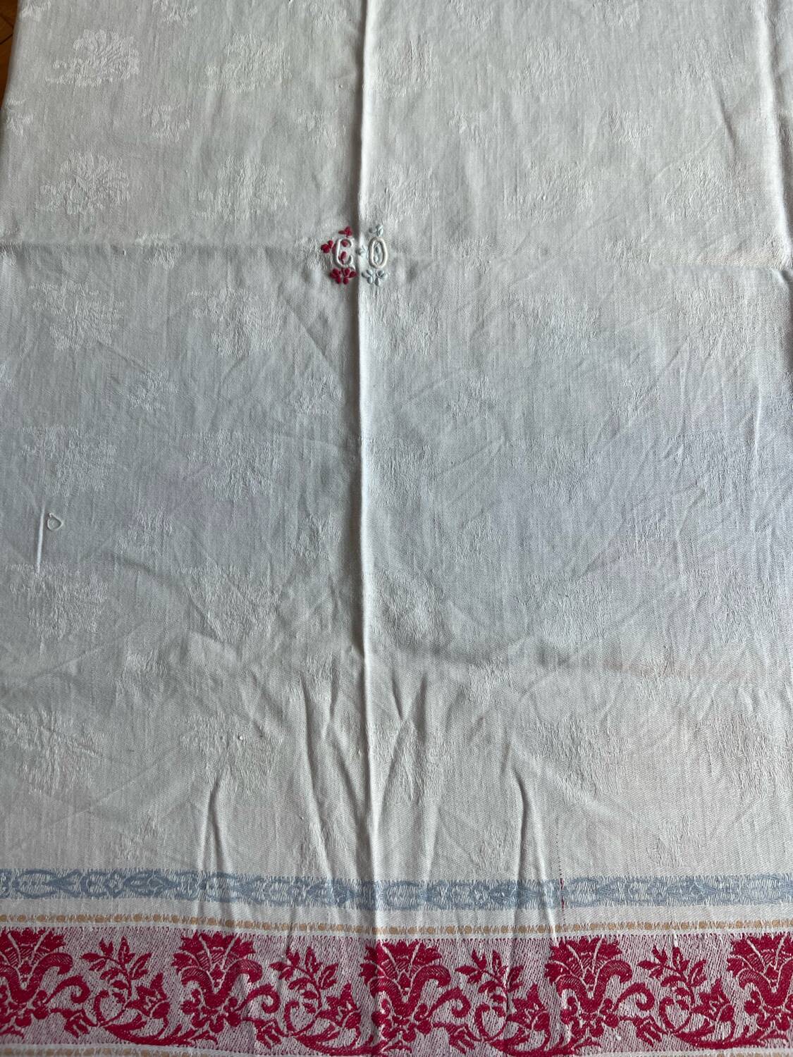 Old cotton tablecloth with flowers and fringes