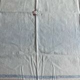 Old cotton tablecloth with flowers and fringes