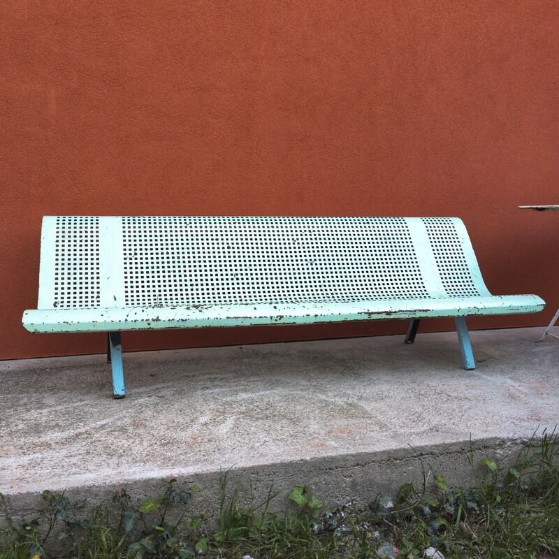 Public bench made of perforated iron