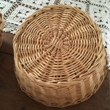 Three natural wicker baskets