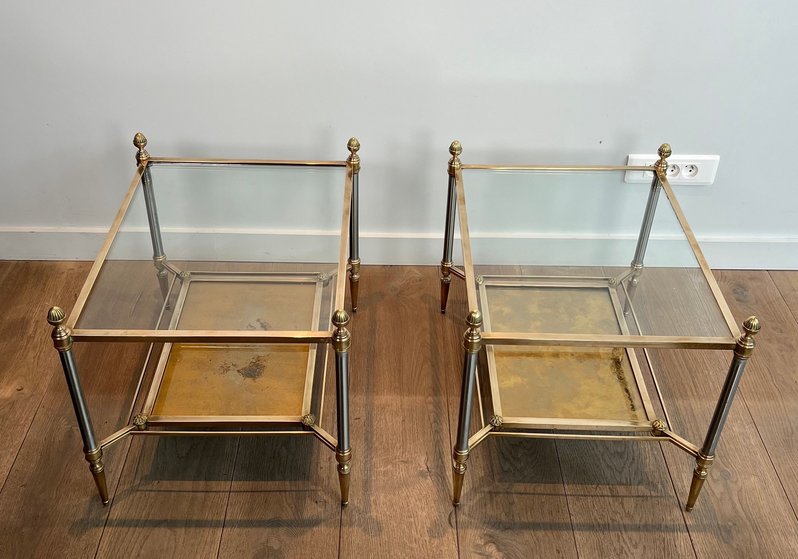 Pair of neoclassical side tables in steel and brass by Maison Jansen.