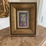 Oriental engraving with its gilded frame