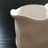 White pitcher streaked in relief