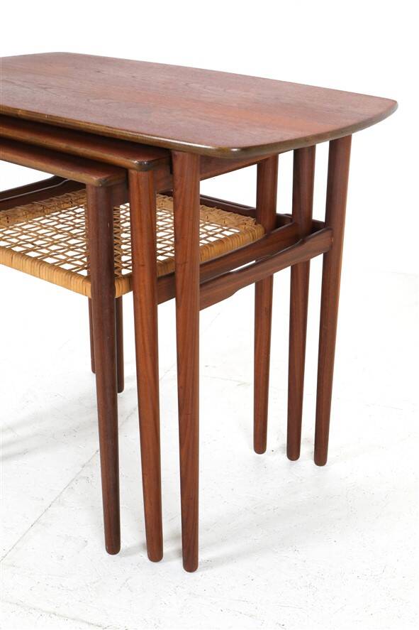 Rare set of three teak nesting tables with cane magazine rack / side tables / mid-century Danish modern design / 1950s / 1960s