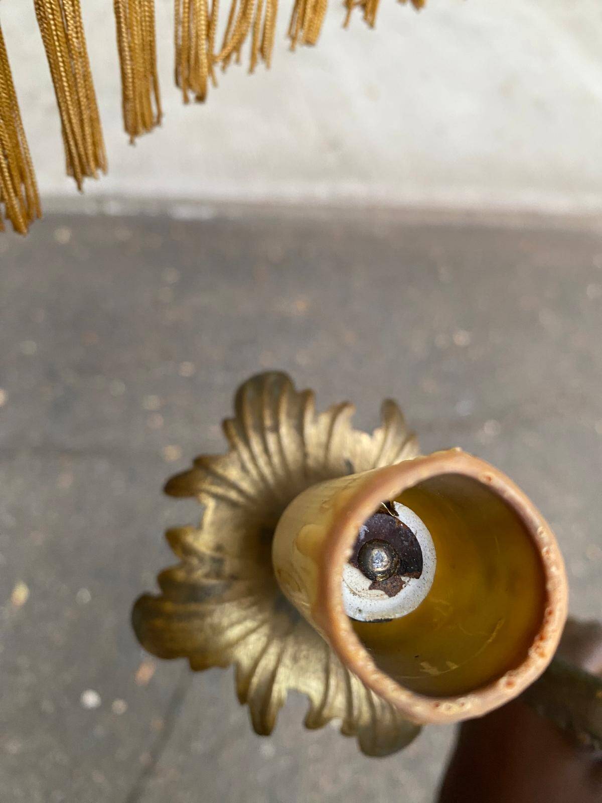 Vintage brass onyx floor lamp with fringed shade.