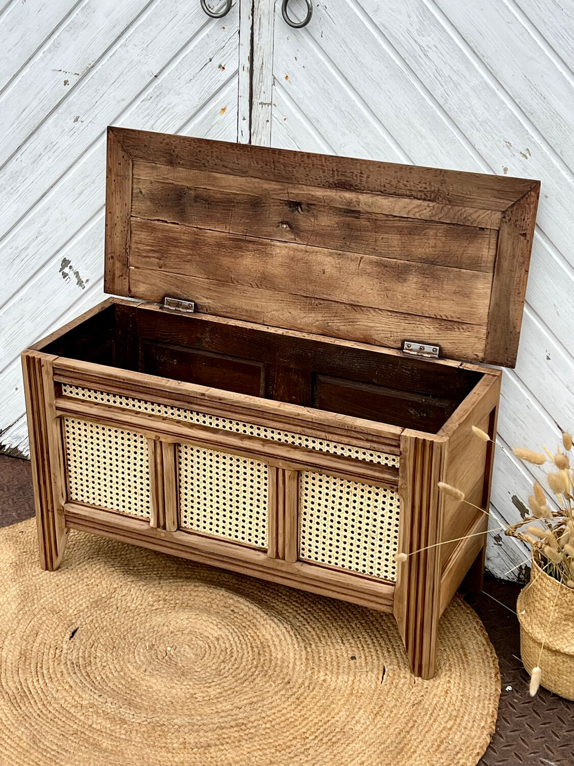 Antique oak chest with raw wood and cane work.