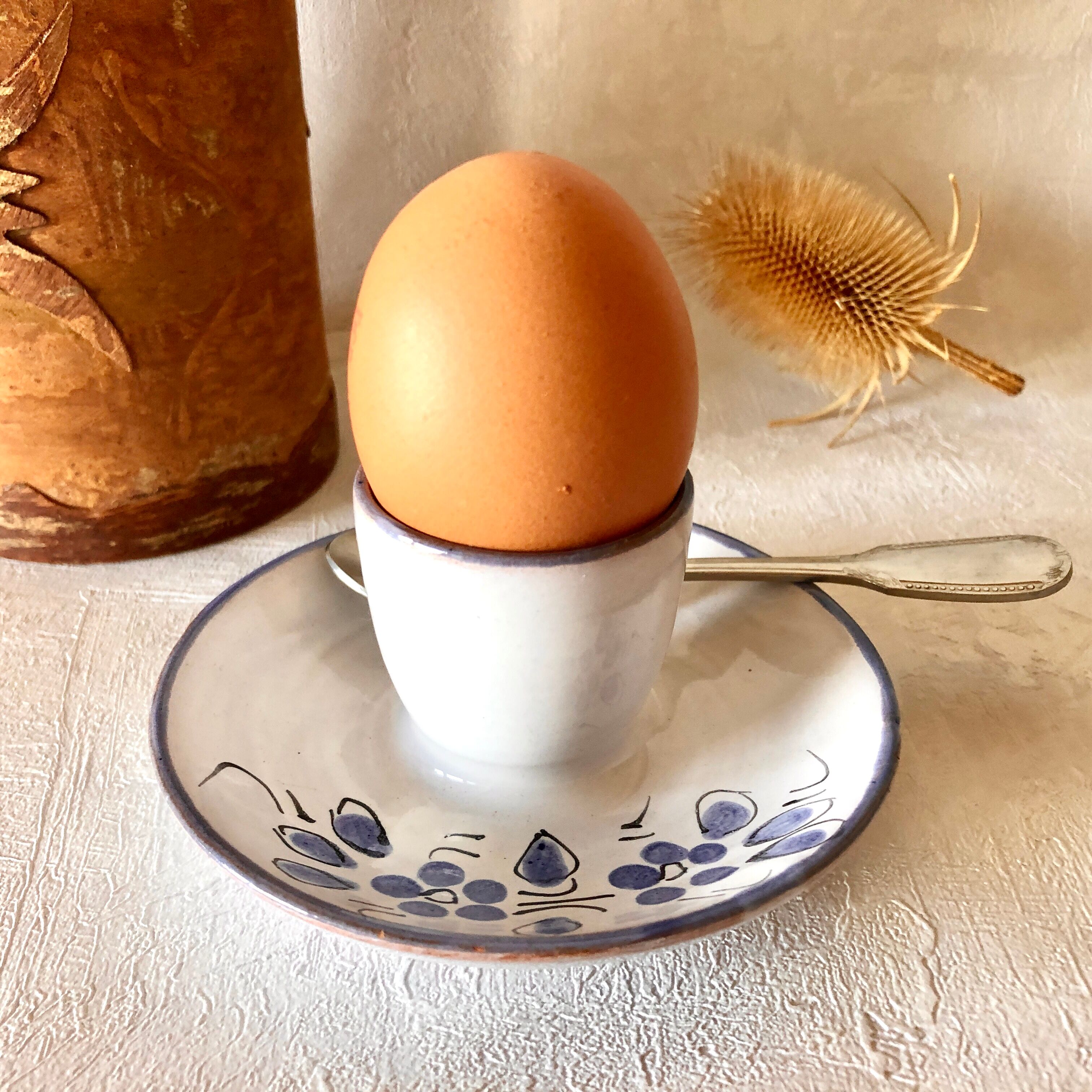 Glazed ceramic shell with painted floral decoration