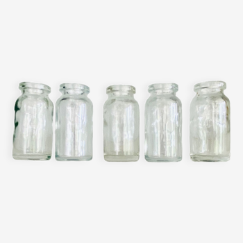 Five antique glass bottles