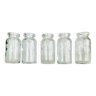 Five antique glass bottles