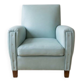 Vintage armchair in light blue faux leather retro style