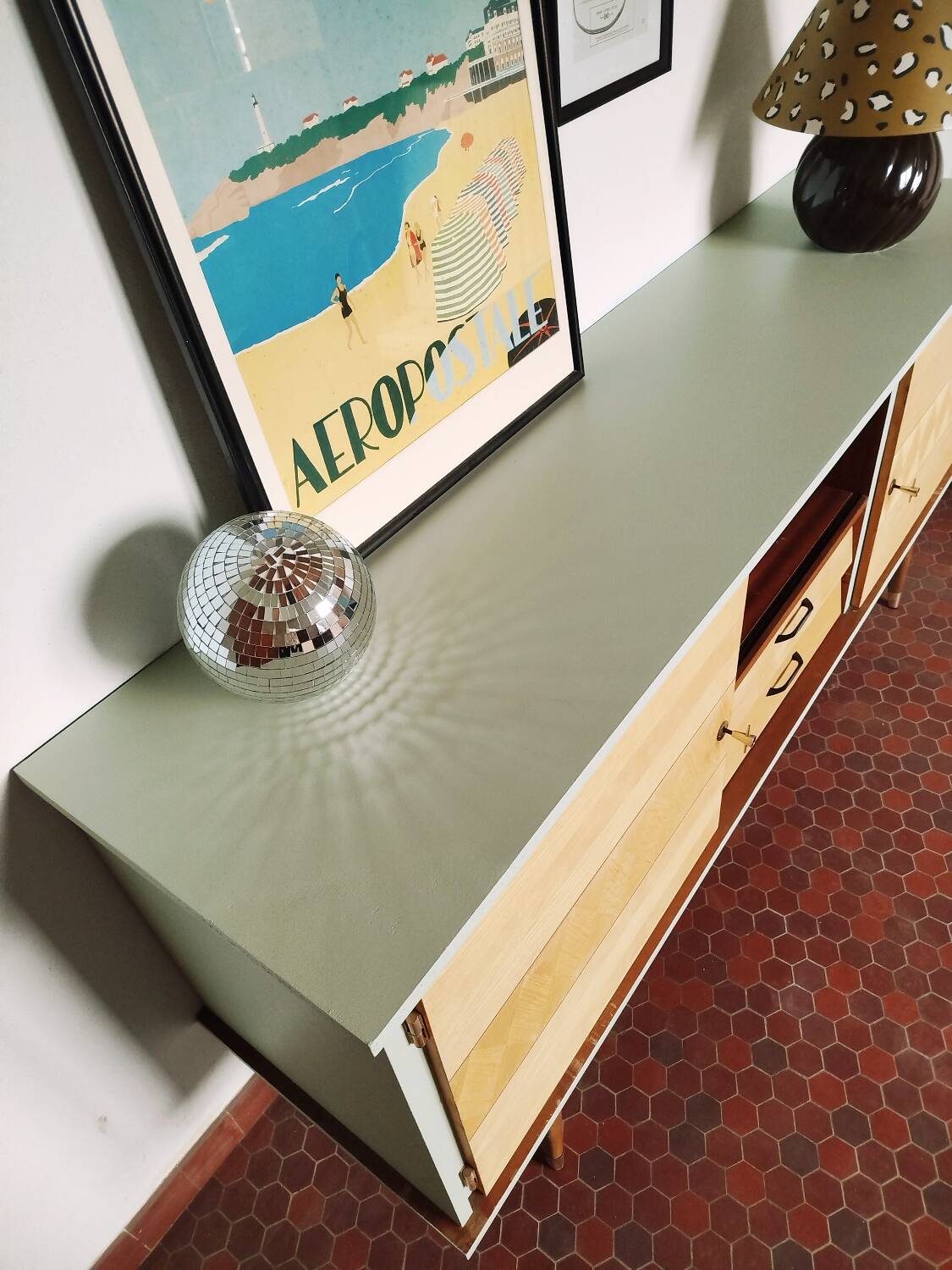 Wooden sideboard in soft green