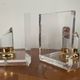 Vintage pair of bookends in lucite and brass from the 1970s.