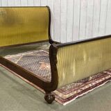 Lit Empire en acajou début XIXème à cols de cygnes et pieds griffes