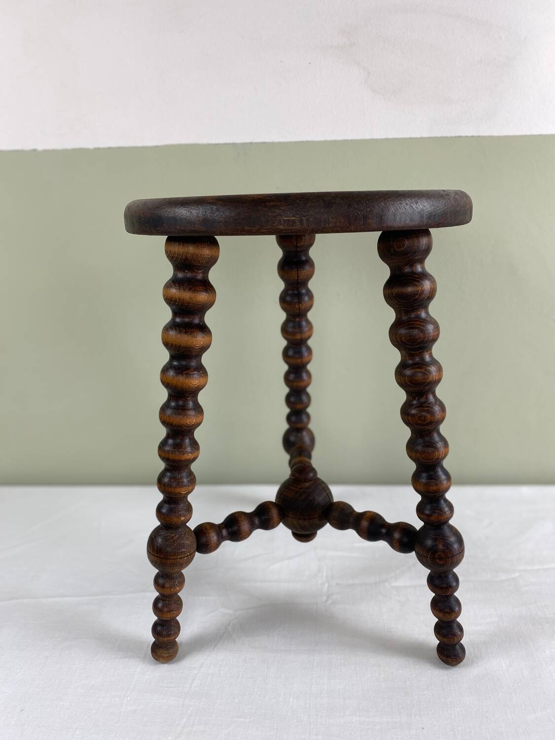 Signed turned wood tripod stool