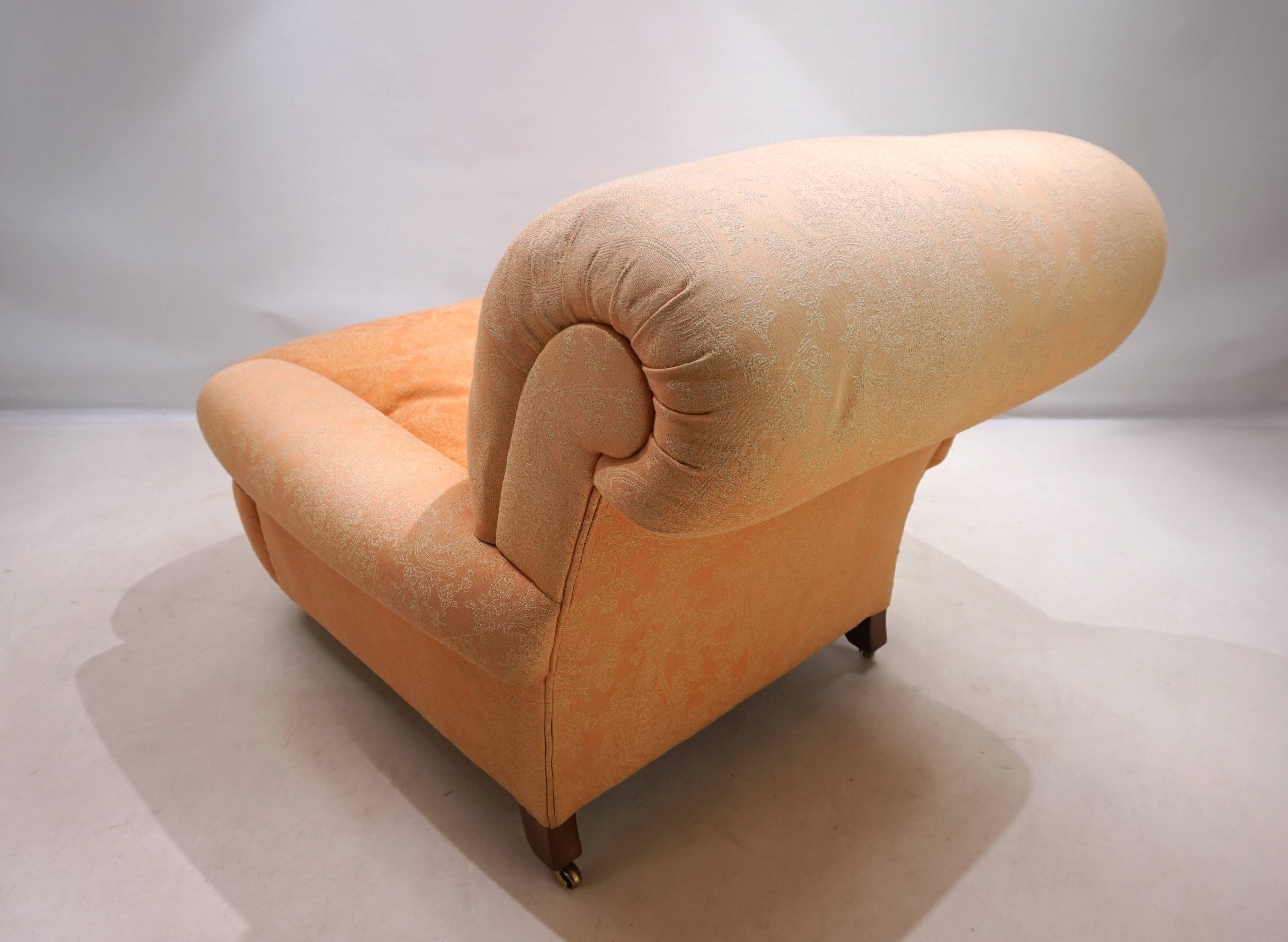 Deep seated armchair in the style of Howard & Sons