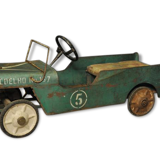 Green metal pedal car