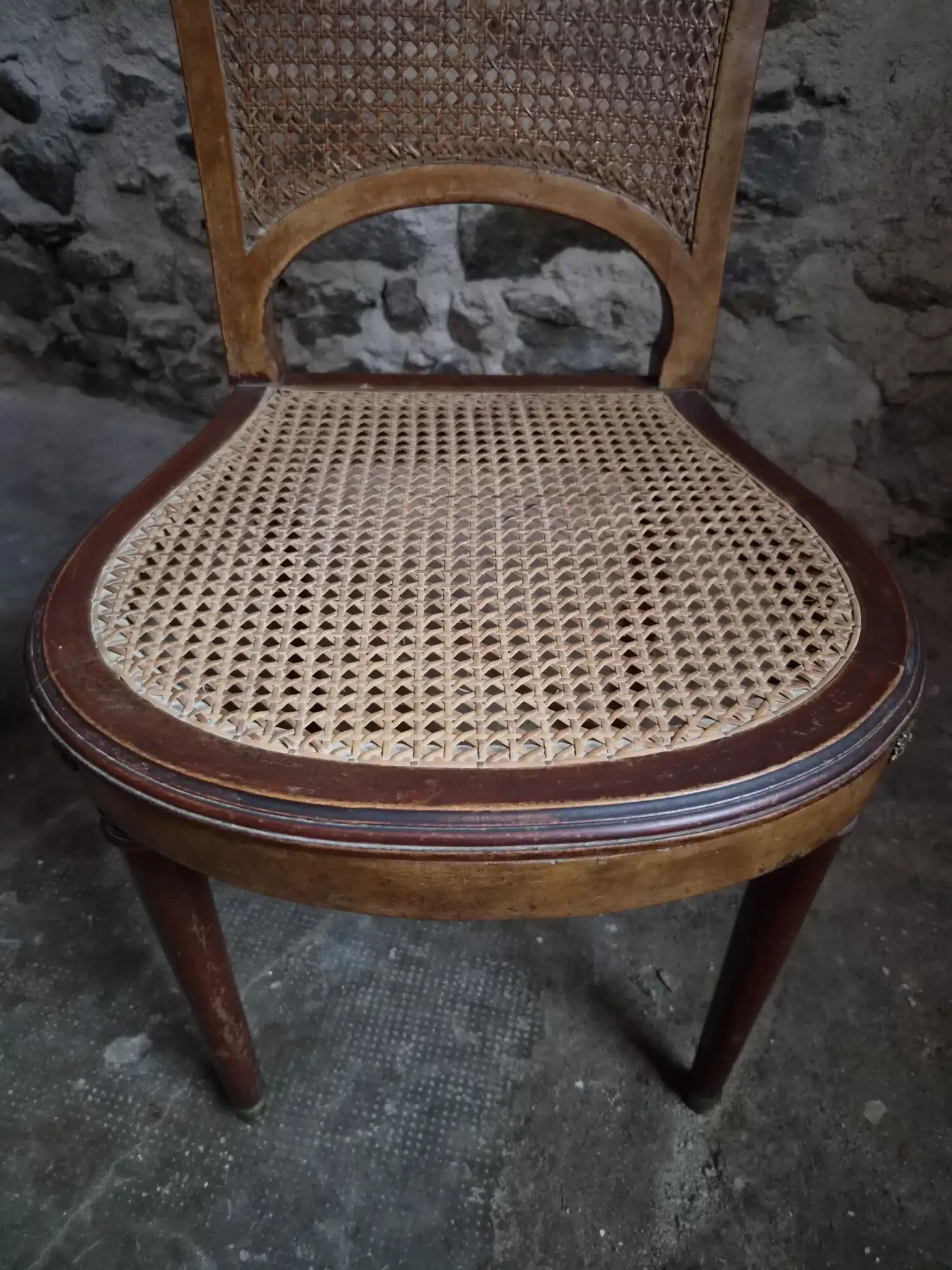 Set of 6 antique Louis XVI style dining chairs with caning.