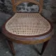 Set of 6 antique Louis XVI style dining chairs with caning.