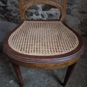 Set of 6 antique Louis XVI style dining chairs with caning.