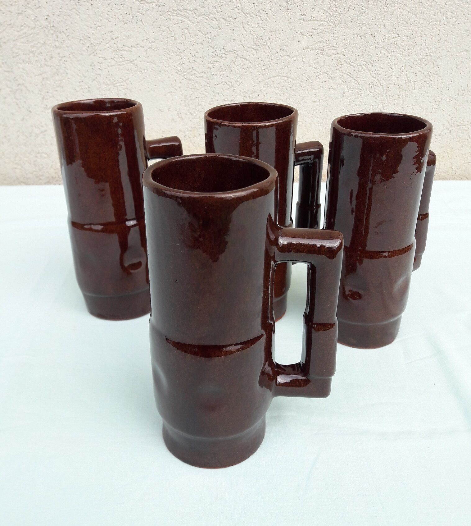 4 brown mugs