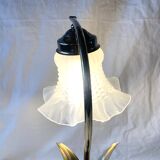 Old brass accent lamp in the shape of a flower
