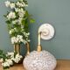 Vintage glass wall lamp with a white Clichy shade.