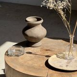 Petrified wood catchall or dish in beige with several grey spots in the centre.