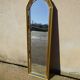 Vertical mirror, gold frame with beading.