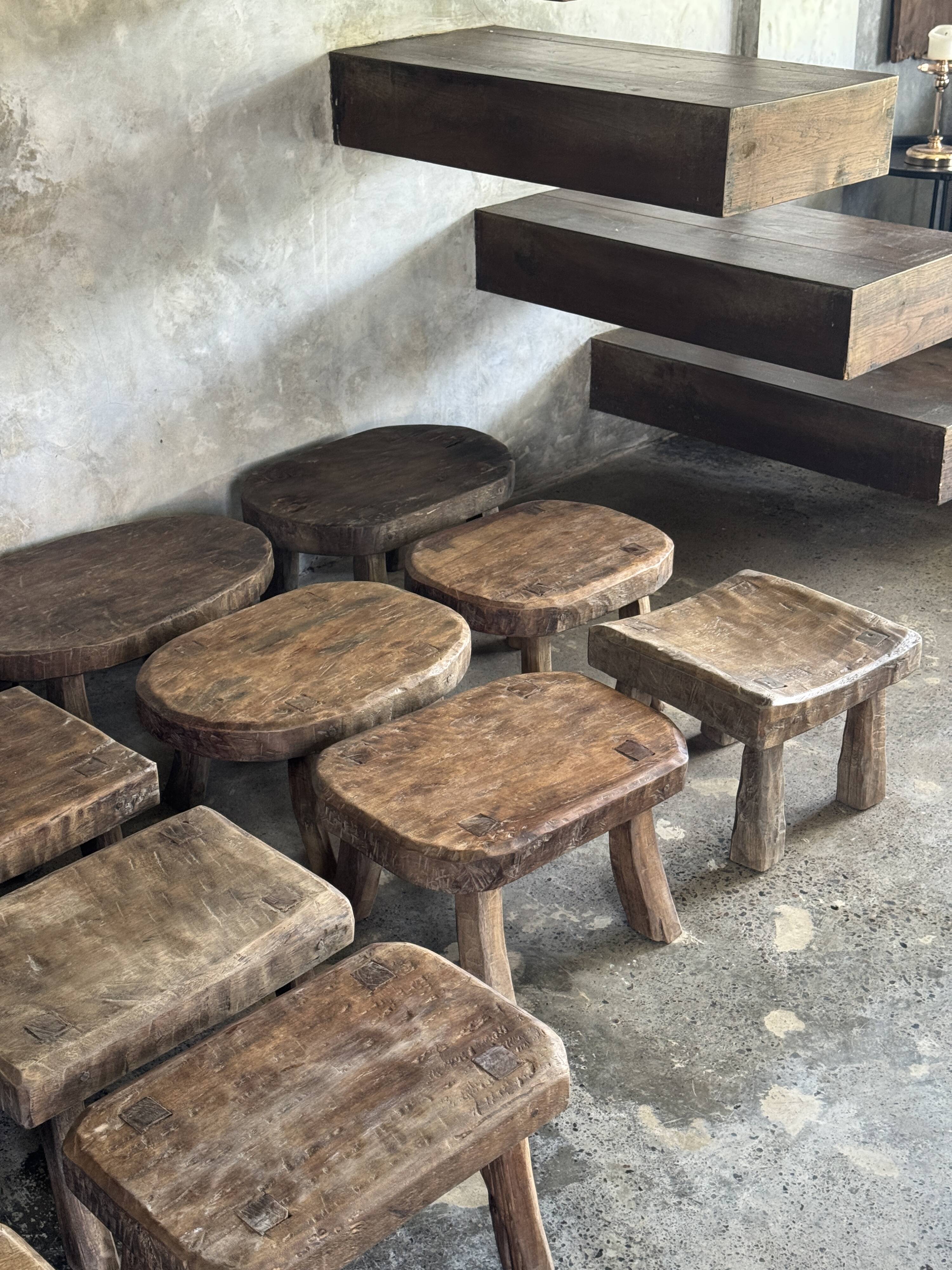Small stool, rectangular solid teak side table with curved legs.